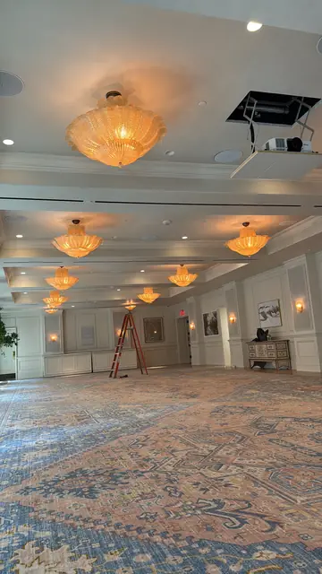 Chandeliers across a hotel ballroom