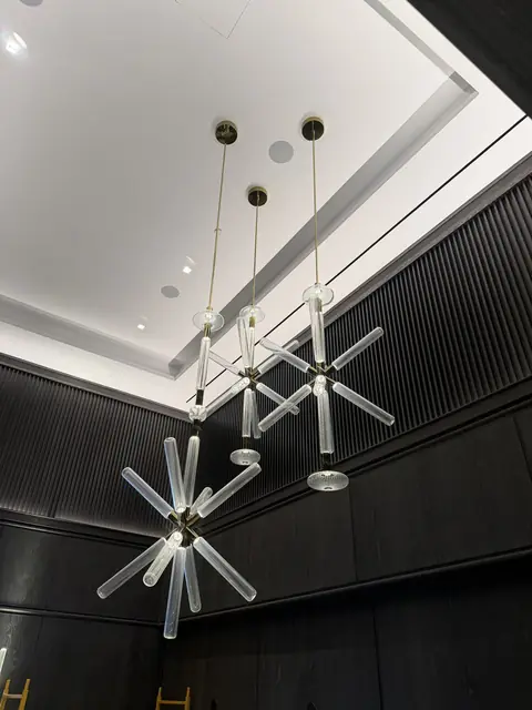 Modern glass pendants in a double-height space