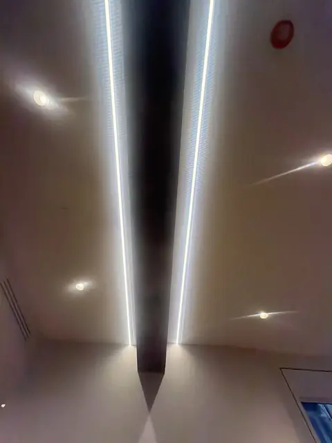Linear LED channels in a ceiling